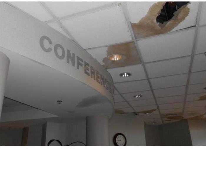 Conference lobby with water damaged ceiling tiles