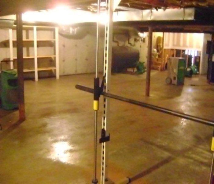 A clean and dry basement that is well lit.  Most of the furniture and items have been removed.