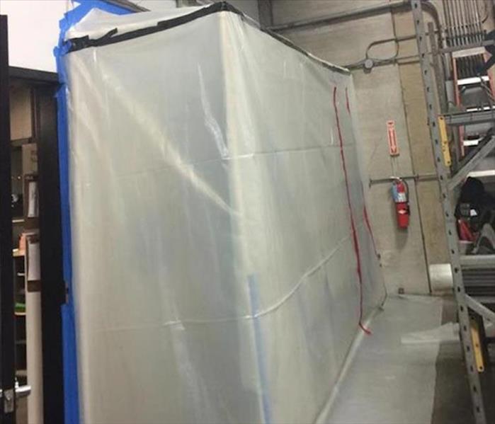 rectangular plastic containment area in a warehouse
