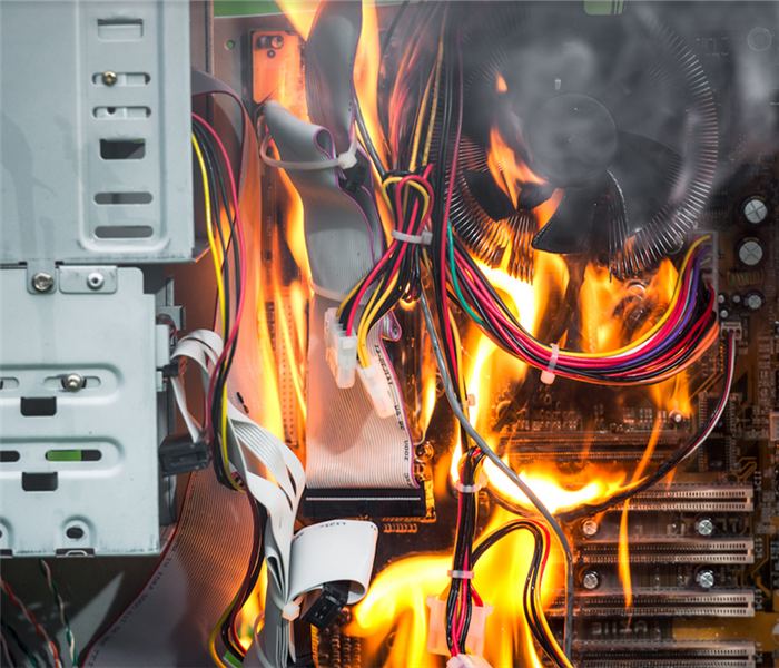 a fire taking over the wires and inside of a computer