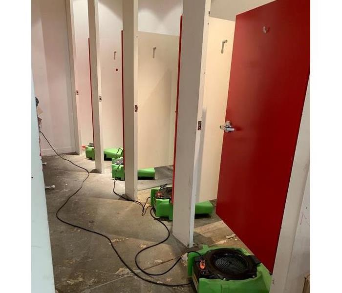 SERVPRO restoration devices in a water damaged bathroom
